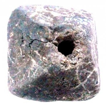 Square spindle whorl showing wear marks around the hole, impasto clay, Scavi Kleibrink 1991-2004, no. 04.30.138. From the Weaving House, Timpone della Motta, 8th c. BC., National Archaeological Museum, Sibari. Square spindle whorl showing wear marks around the hole, impasto clay, Scavi Kleibrink 1991-2004, no. 04.30.138. From the Weaving House, Timpone della Motta, 8th c. BC., National Archaeological Museum, Sibari.